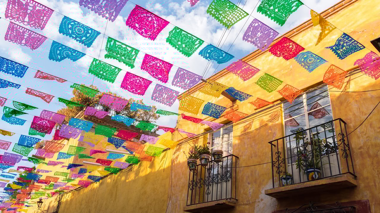 Paper flags strung over a street in San Miguel de Allende, Mexico (© William Zinn/Getty Images)