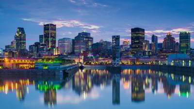 Bing wallpaper June 13, 2025. Montreal skyline reflecting in St. Lawrence River, Quebec (© Walter Bibikow/Stone/Getty Images)