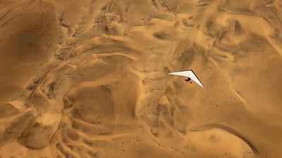 Bing wallpaper May 6, 2025. An ultralight aircraft flying over the sands of Namibia (© Burt Johnson/Alamy)