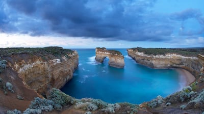 Bing wallpaper August 12, 2020. Window arch at Loch Ard Gorge at dawn, Port Campbell National Park, Victoria (© David Noton/Minden Pictures)