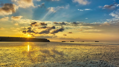 Bing wallpaper June 6, 2025. Arromanches-les-Bains in Normandy, France (© Horia Merla/Getty Images)